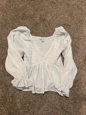 Smocked V-Neck Peplum Blouse in White
